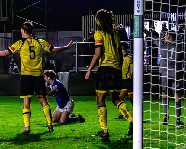 Coleby Shepherd is brought down for the late Whitby Town penalty.