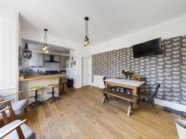 The open plan kitchen and diner has space for relaxed seating too.