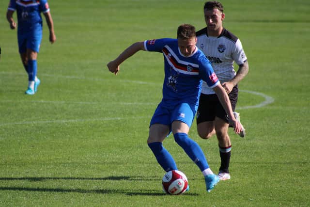 The visitors hold off Mossley during Saturday's FA Cup clash. Photos by Owen Cox