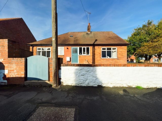 An alternative view of the bungalow and its substantial plot.