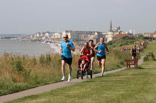 Bridlington Road Runners trio James Briggs, Phill Taylor and Nick Jordan race along the clifftops at Sewerby Parklrun. PHOTOS BY TCF PHOTOGRAPHY