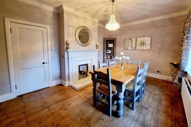 A pleasant and sizeable dining room with fireplace.