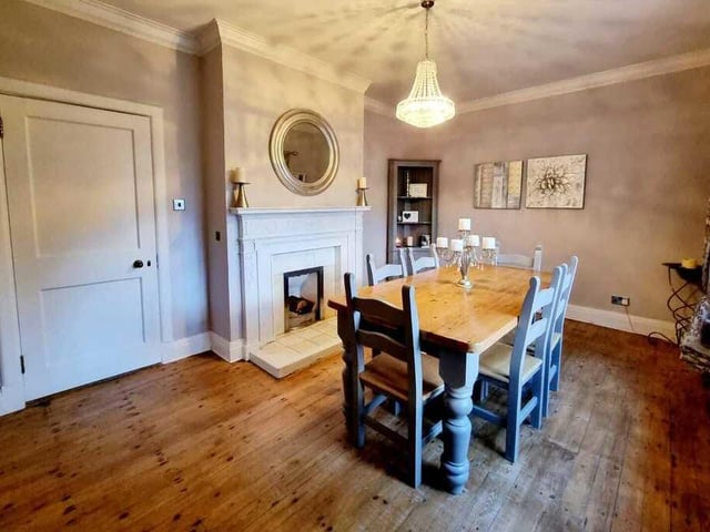 A pleasant and sizeable dining room with fireplace.