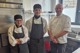 East Riding College students Sarah Friberg and Lewis Gurney alongside Anthony Gascoigne, Hospitality Programme leader.