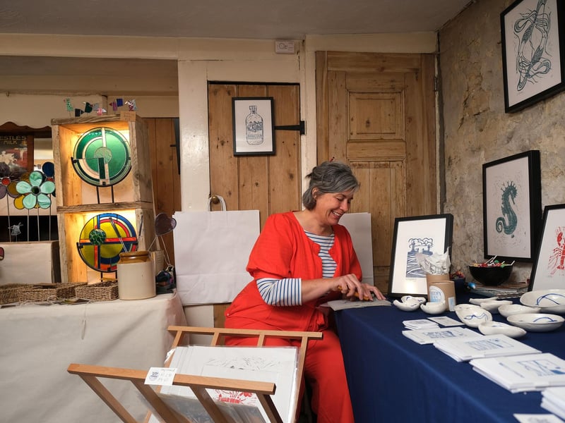 Artist Emily Burns of Salty Sea Prints working the gallery.