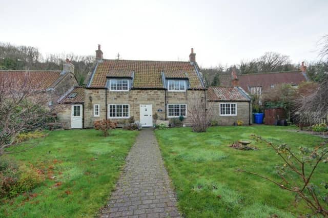 The Grade ll-listed cottage that is currently for sale in Sandsend.