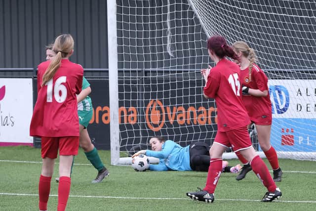 Debutant keeper Brooke Mason makes a save for the home side.