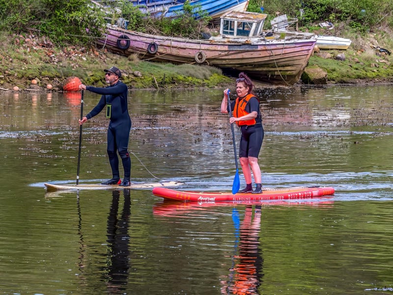 Paddle boarders heading up the River Esk.
picture by Brian Murfield