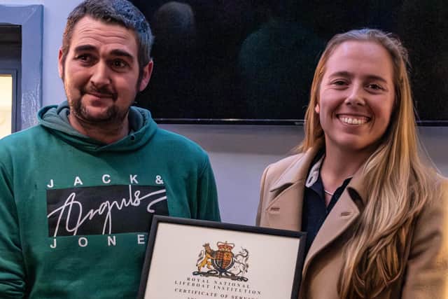 Anna Heslop presenting Drew Baxter with his certificate of service