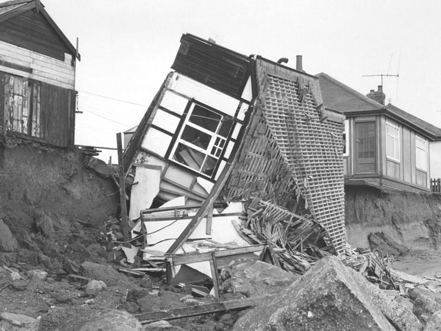 Houses falling into the sea, believed to be near Bridlington (year unknown).