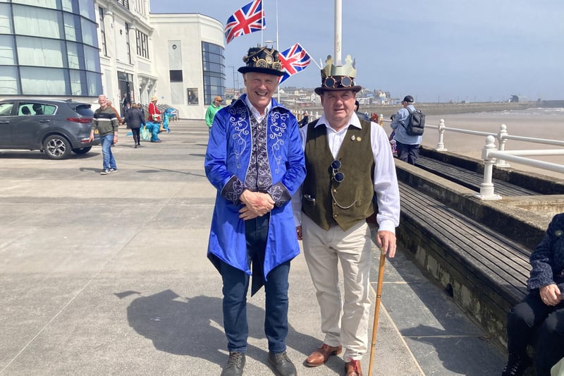 These two well-dressed gentlemen were letting their flags fly in the sea breeze.
