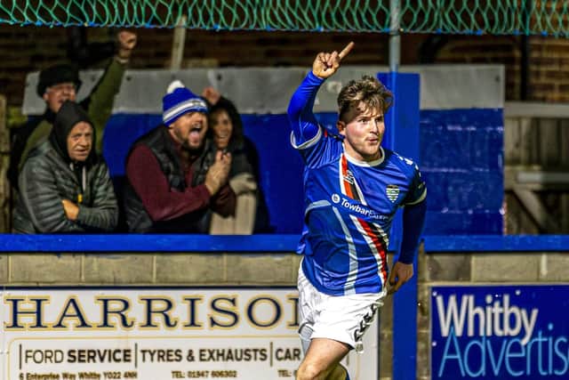 Sam Collins celebrates after putting Town 2-0 ahead. Photo by Brian Murfield