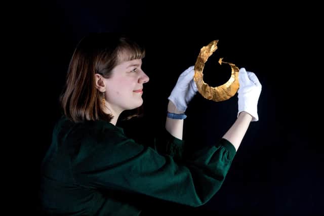 Craven Museum curator, Charlotte Craig, with the gold lunula which has gone on permanent display in Skipton.