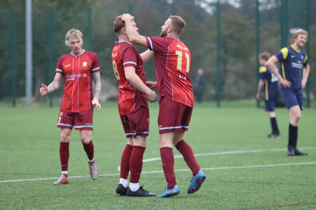 The hosts celebrate a goal. PHOTOS BY TCF PHOTOGRAPHY