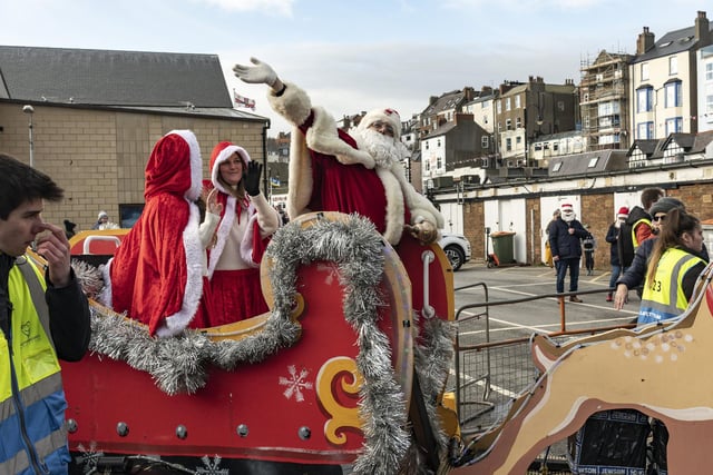 Santa travelled around Scarborough on his sleigh with his helpers.