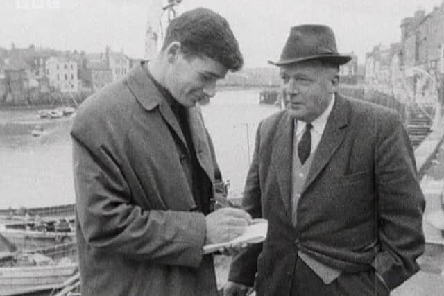 Gazette reporter Don Wood carries out an interview.