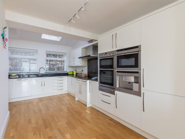 The fitted kitchen has an adjacent breakfast room.