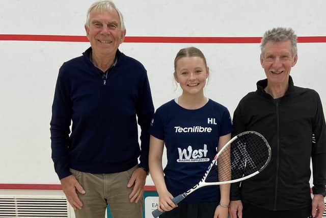 Bridlington's Hattie Langley, centre, is with her sponsor West Building Supplies, left.