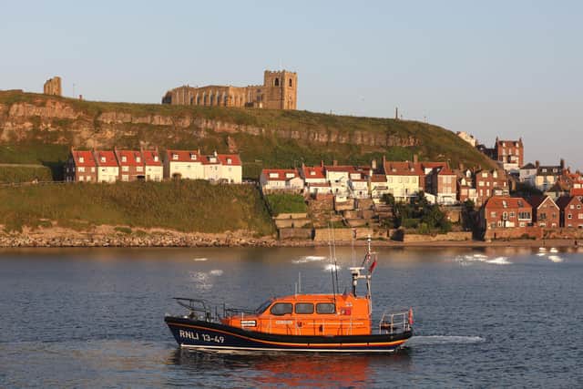Whitby's all weather lifeboat, Lois Ivan, below St Mary's Churchphoto: RNLI/Ceri Oakes
