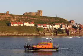 Whitby's all weather lifeboat, Lois Ivan, below St Mary's Churchphoto: RNLI/Ceri Oakes