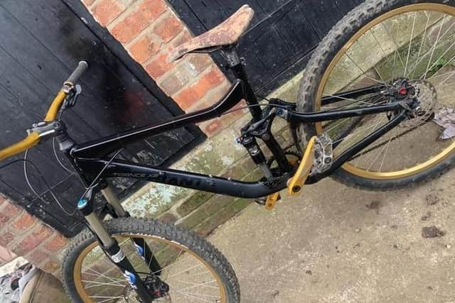The bike is as seen in the photograph, however, it now has red wheels.