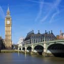 The Big Ben and Palace of Westminster under a clear blue London sky.