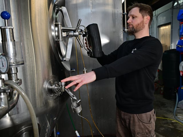 Richard Wells checking the tanks.