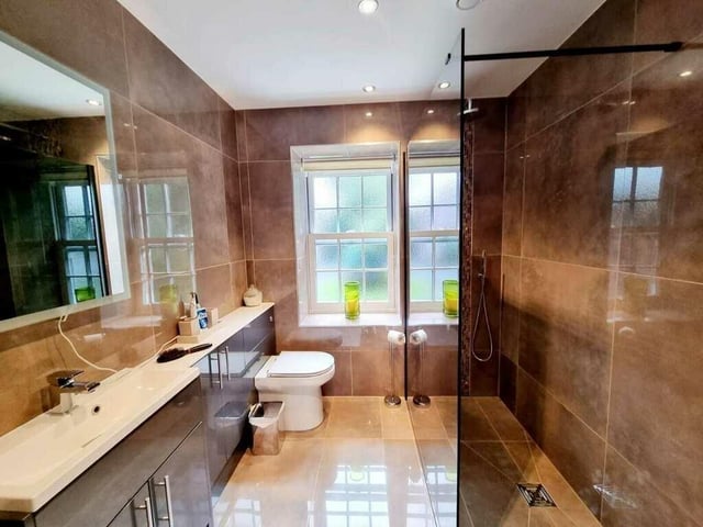 One of three bath and shower rooms in the property.