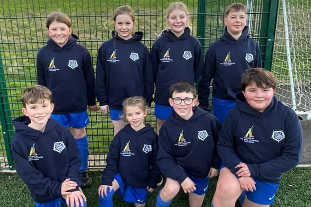The Seton School football team wearing their new hoodies, bought with the £1,000 donated by the The Mike Armstrong foundation to the school, before competing in a football tournament against other Whitby schools.