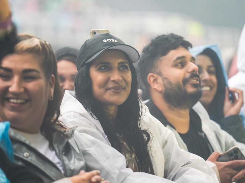 Fans in ponchos enjoying Dermot Kennedy's Scarborough show, despite the rain.