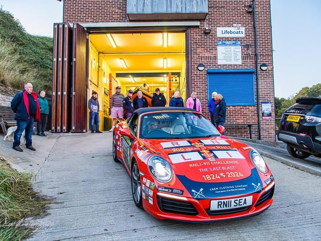 Admiring the stunning vehicle.