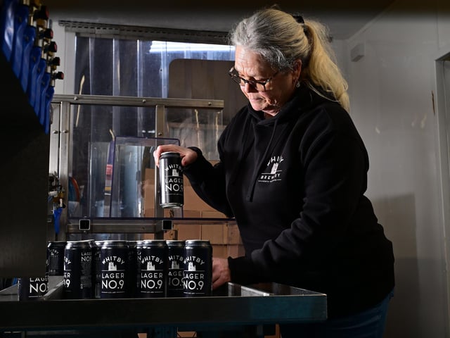 Mandy Messruther checks the product.