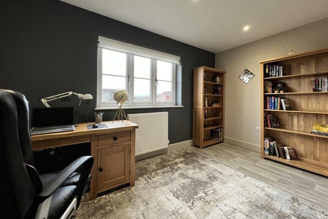 Versatile room space allows for a home office if so desired.