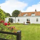 The attractive property in Flamborough, as viewed from its established garden.