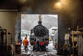 Engineers at Grosmont pictured unfreezing a steam Locomotive with fire, preparing it for a steam test.