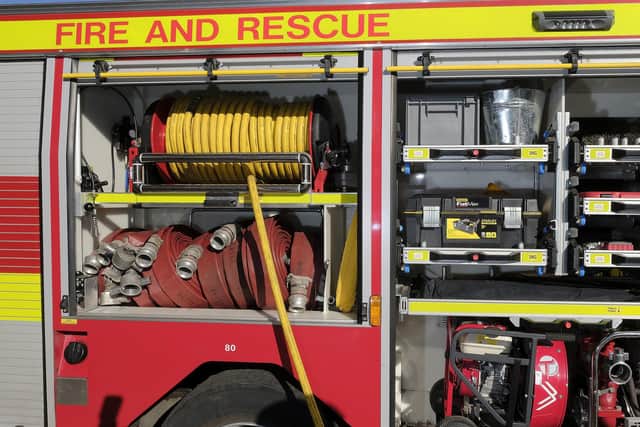 Fire crews released two people who became trapped in their vehicles on Tuesday.