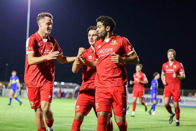Charlie Birdsall, Ben Tweed and Ahmed Salam celebrating Salam's penalty at Garforth in the FA Trophy. Photo by EC Media