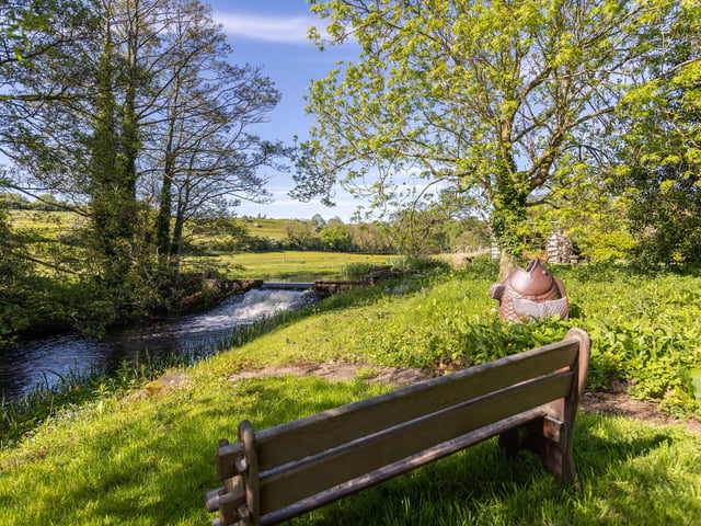Sit and enjoy an impressive water feature from your garden, courtesy of the River Derwent.