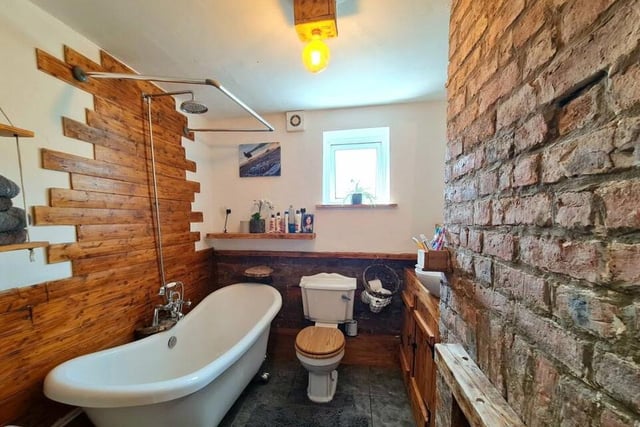 An en suite facility with free standing bath tub.