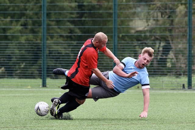 The players get stuck in during the East Riding County League encounter.