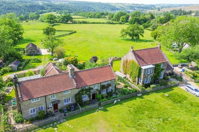 An aerial view showing the stunning location of the cottage.