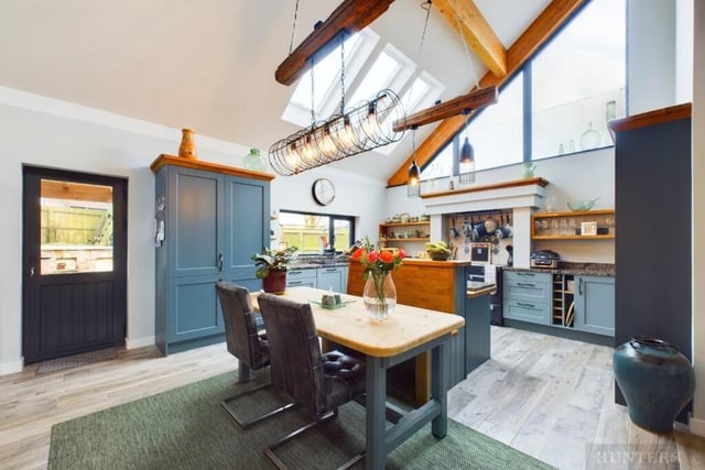 The open plan kitchen and diner has a central island.