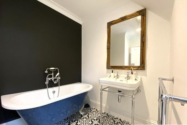 The free standing bath in this bathroom that also has a walk in shower.