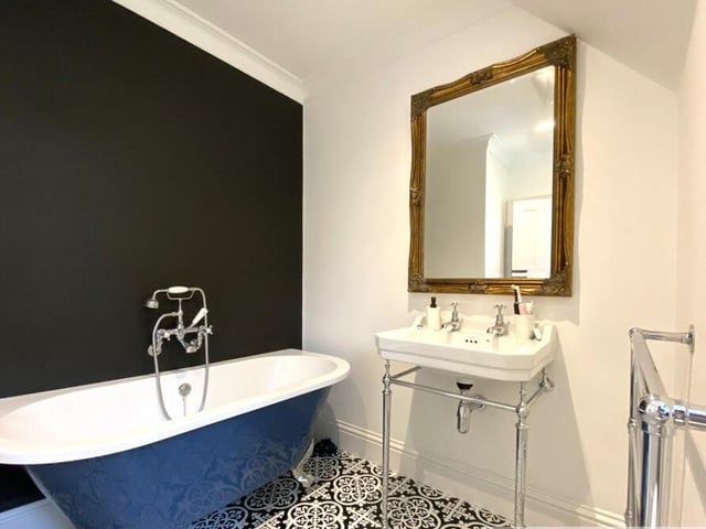 The free standing bath in this bathroom that also has a walk in shower.