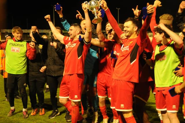 The Seasiders show off their silverware after the dramatic finale.
