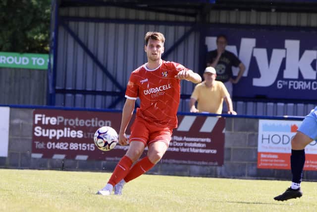 Will Annan lobs the ball forward for the visitors. Photo by Alexander Fynn