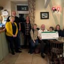 Graham's Gallon walk cheque presentation to the Great North Air Ambulance.