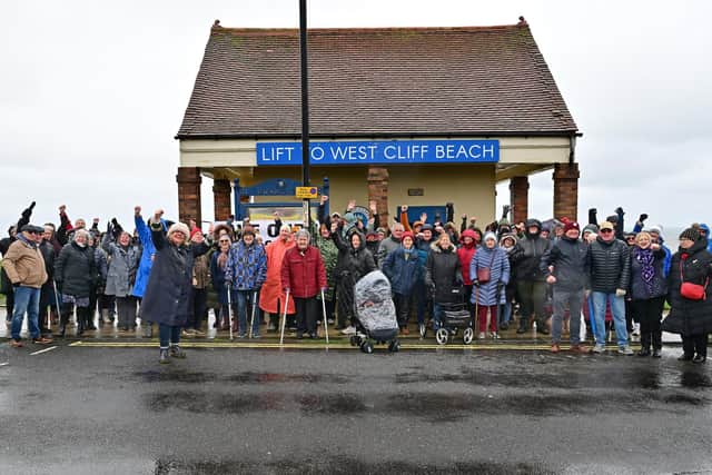 Protestors gather in awful weather by Whitby cliff lift. photo: Richard Ponter