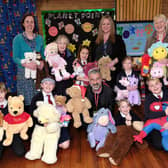 Mehmet Kaya (front, centre) with someof the toys collected by East Ayton School pupils with Deputy Head Clare Wilborne, Jannette Mullineaux, Lisa Nellist, Suzanne Carr and pupils.