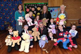 Mehmet Kaya (front, centre) with someof the toys collected by East Ayton School pupils with Deputy Head Clare Wilborne, Jannette Mullineaux, Lisa Nellist, Suzanne Carr and pupils.